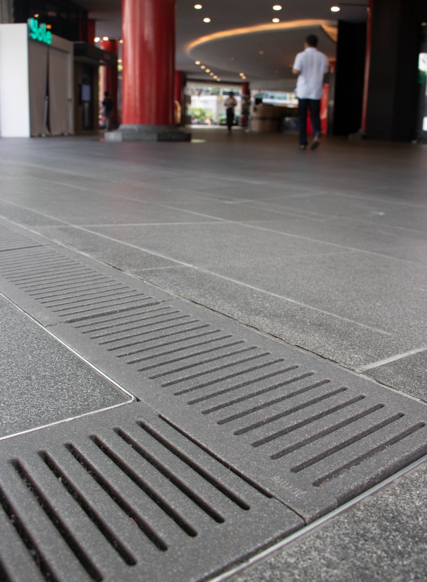 Jonite trench grates in the ground at Orchard MRT