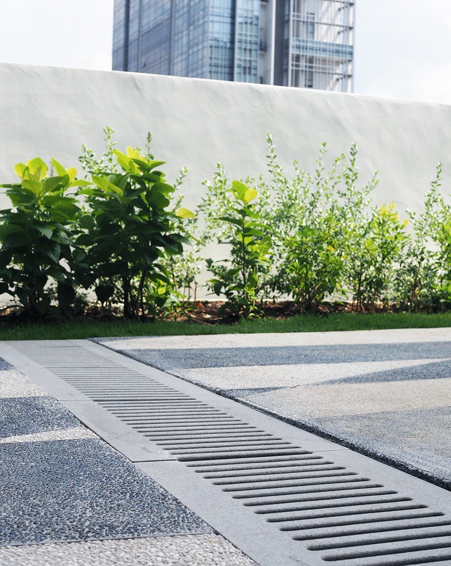 Jonite trench grates blend in naturally with stone pavements in Crown Robinson