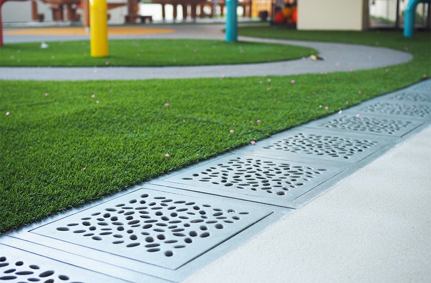 Jonite Projects- Custom stone reinforced trench grates in Early Learning Village