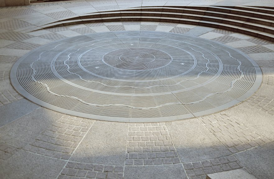 Central design feature in Wheelock Place using Jonite custom trench grates