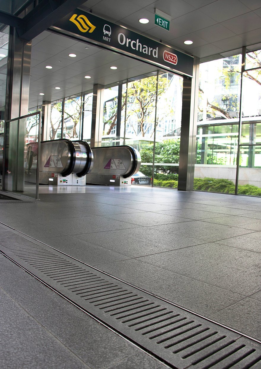 Jonite trench grates installed near the escalator at the Orchard MRT station