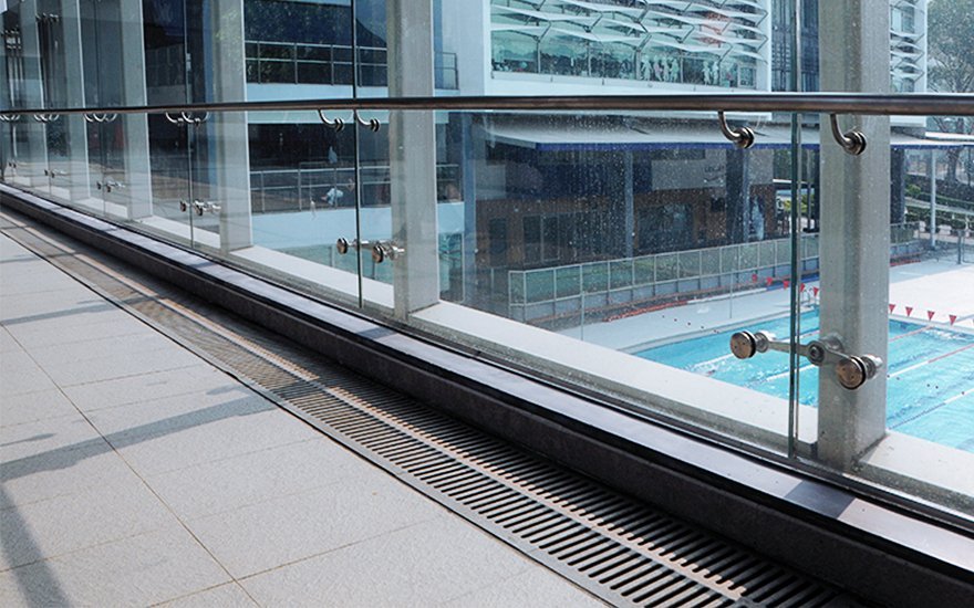 Jonite grates next to windows overlooking a pool