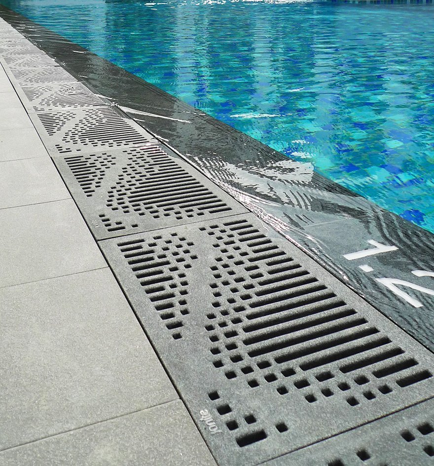 Jonite grates at the edge of a pool at the Charlton Villa