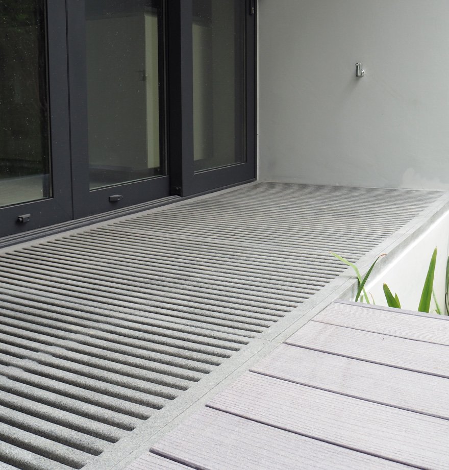 Jonite grates near a door at the Asimont Villas