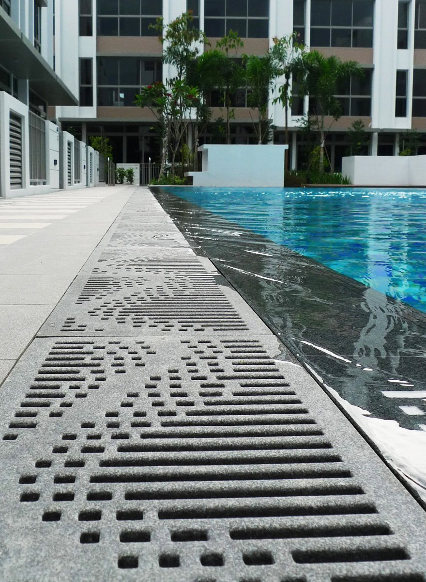 Jonite stone pool grates at the edge of a pool at Charlton Villa