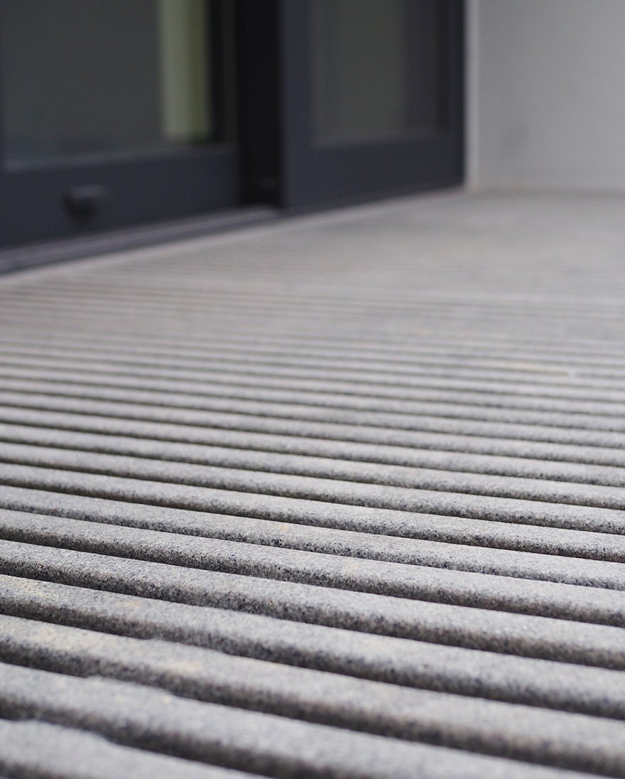 close up image of Jonite stone grates outside of a door