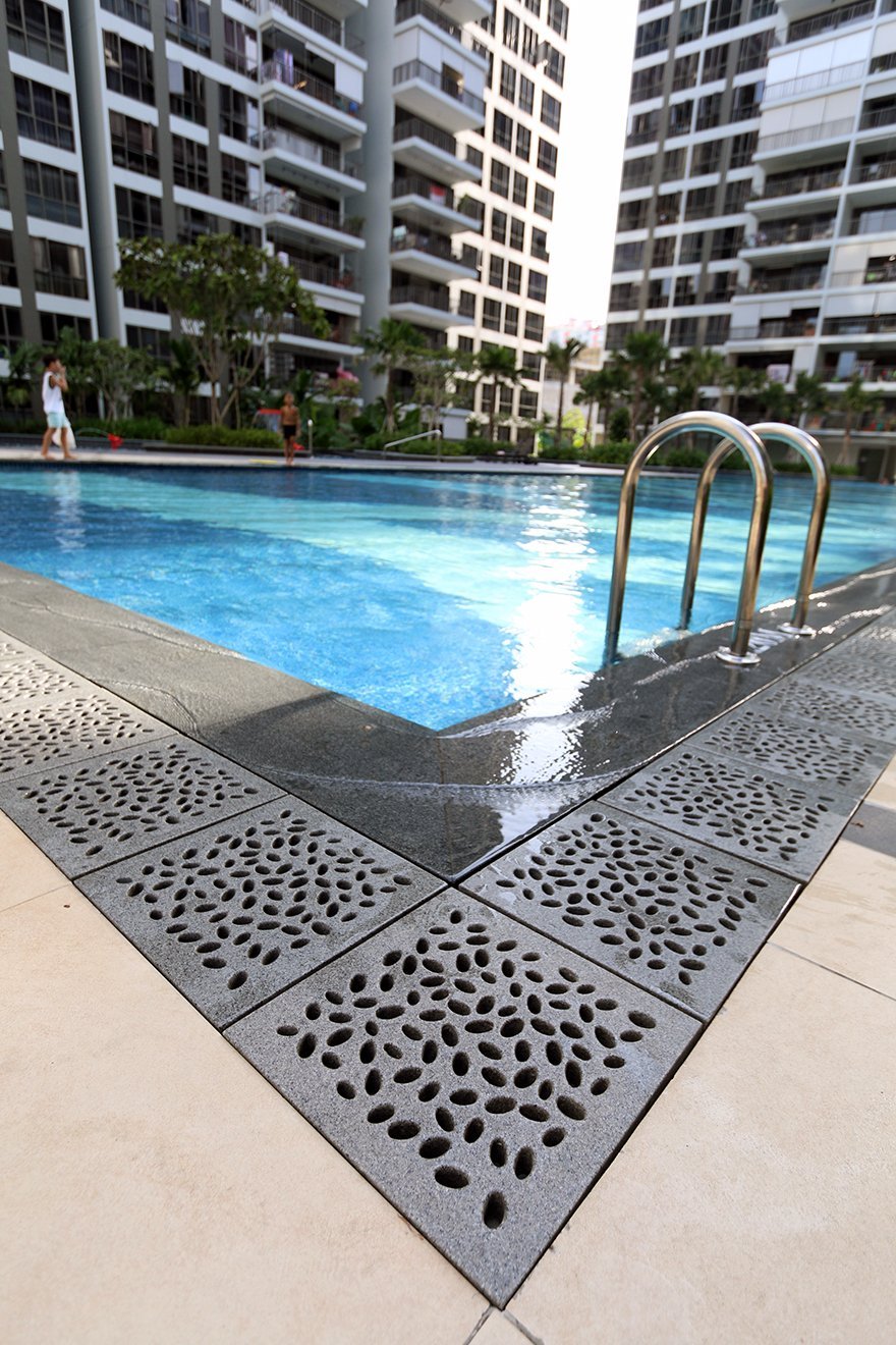 Jonite stone grates around a pool at Punggol Waterwoods