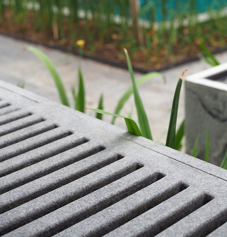 Jonite grate next to greenery at Asimont Villas