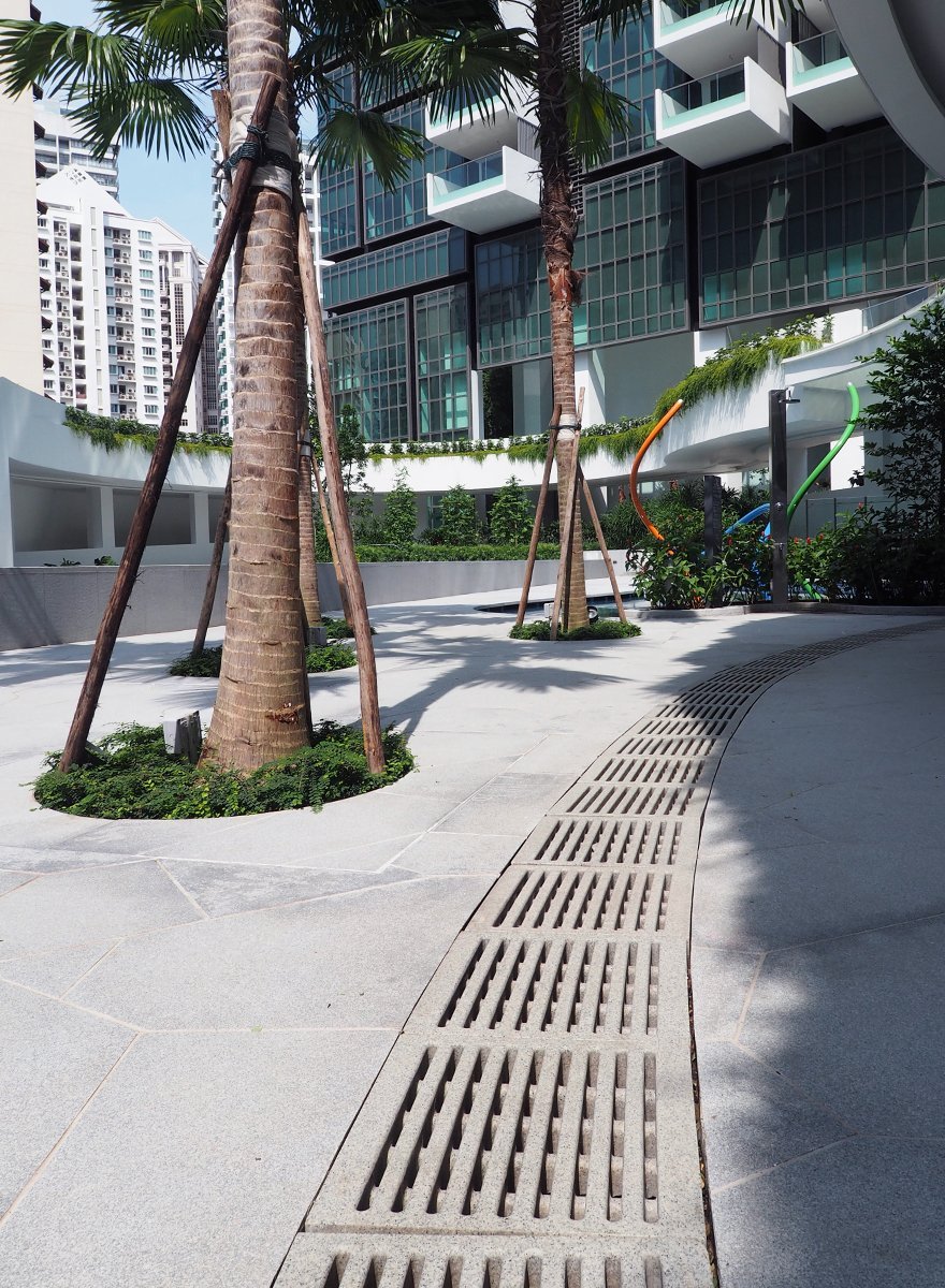 Jonite trench grates industrial design in commercial mixed use building 8 St Thomas Singapore