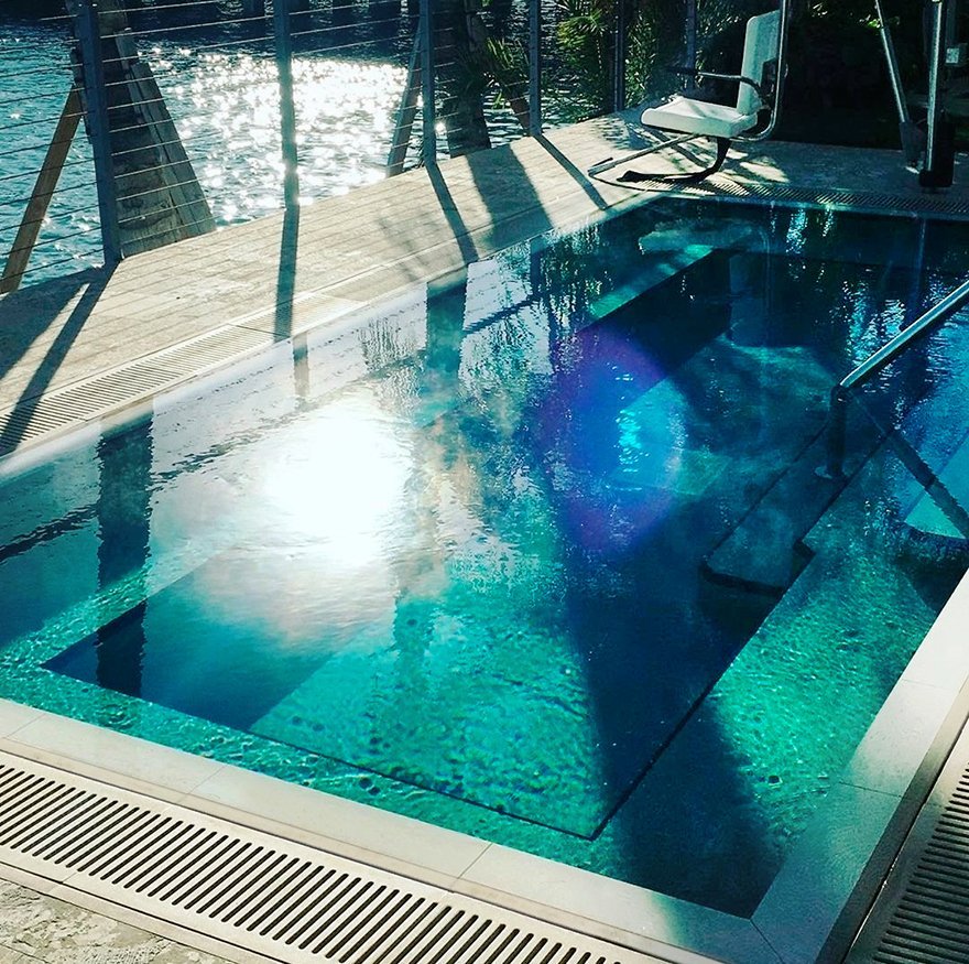 Jonite stone pool grates around a small plunge pool at Grand Beach Hotel