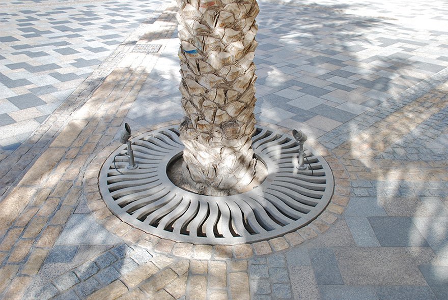 Elaborate stone reinforced tree grates in Burjside Boulevard