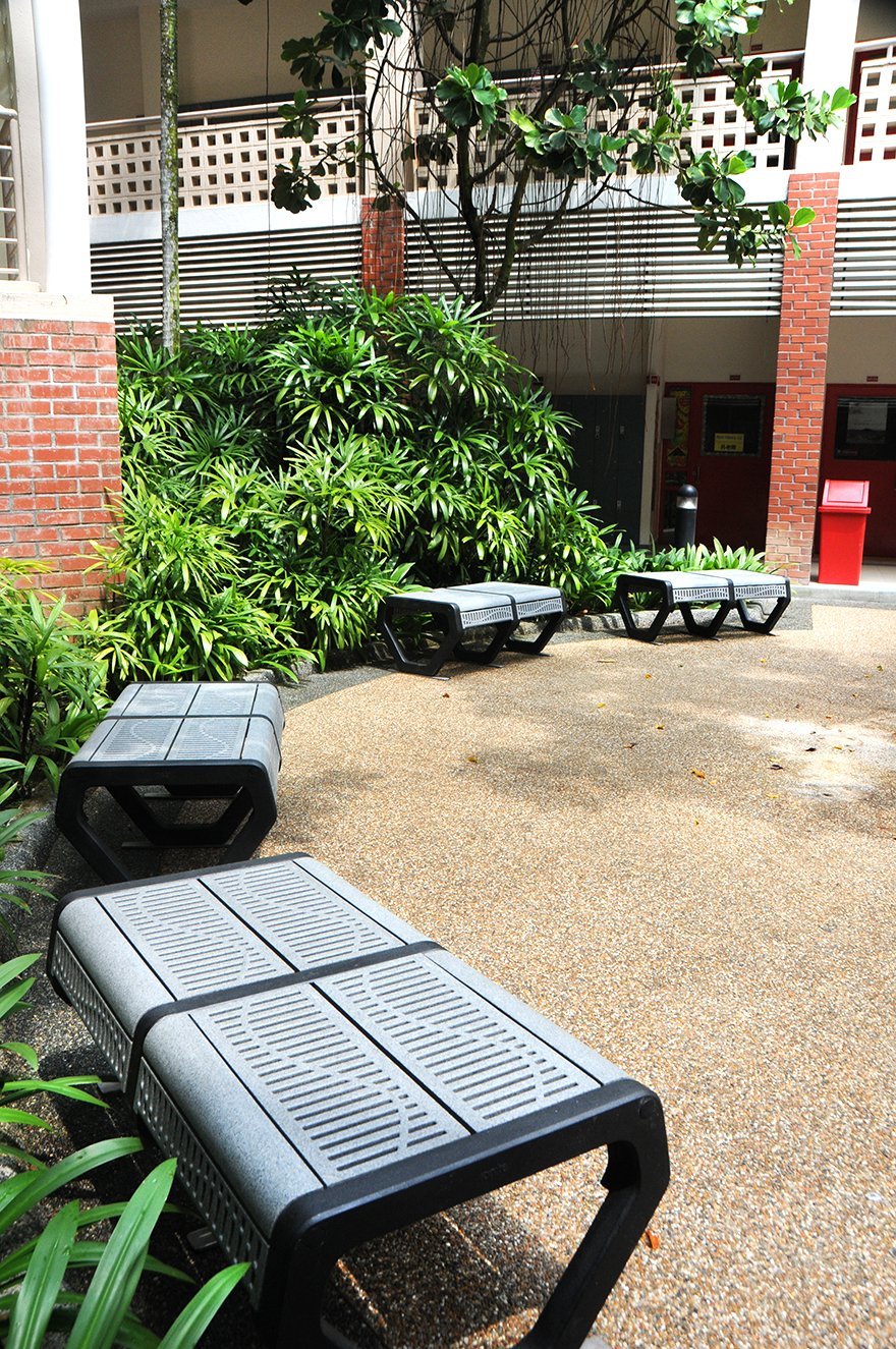 four Jonite stone benches outside of Stamford American