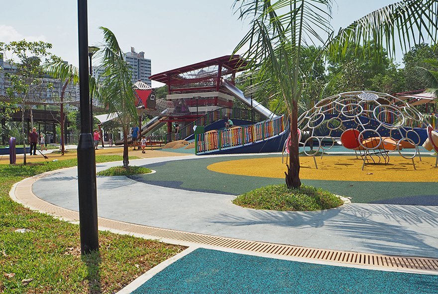 Joniite trench grates circling children's play area in Marine Cove Singapore