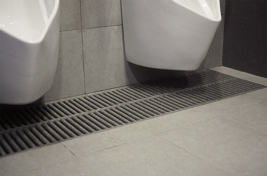 Jonite stone reinforced bathroom grates in Singpost Centre