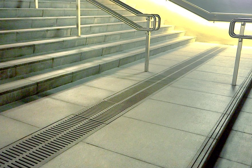 Simple minimal reinforced stone trench grates in commercial use