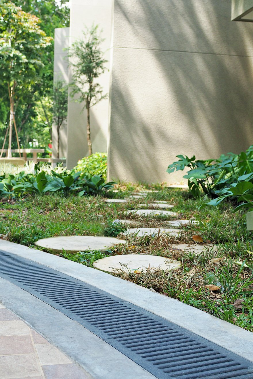 Jonite stone grates next to stepping stones outside of Downtown East