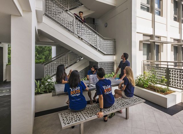 students sitting at a table with Jonite benches at Yale NUS