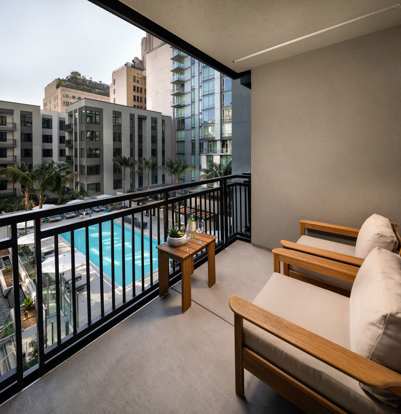 balcony area overlooking the pool at Trademark 437