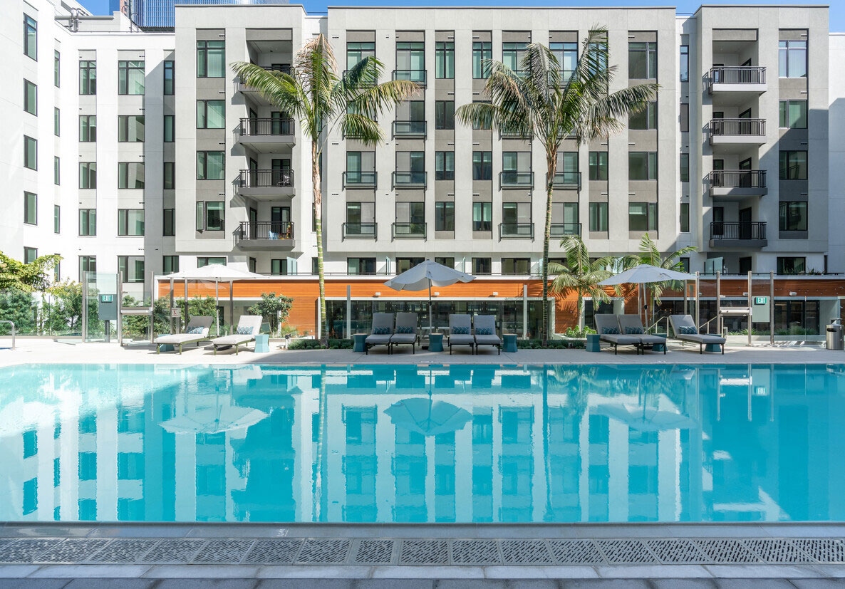 view of the pool and backside of Trademark 437 Apartments