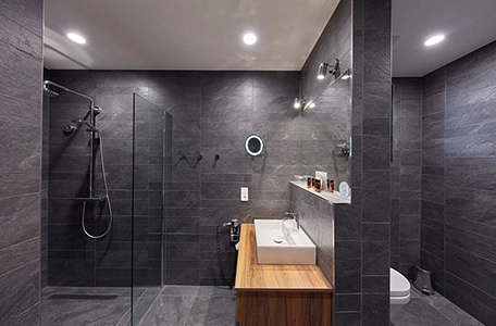 modern bathroom with Modulo Basic shower drains installed