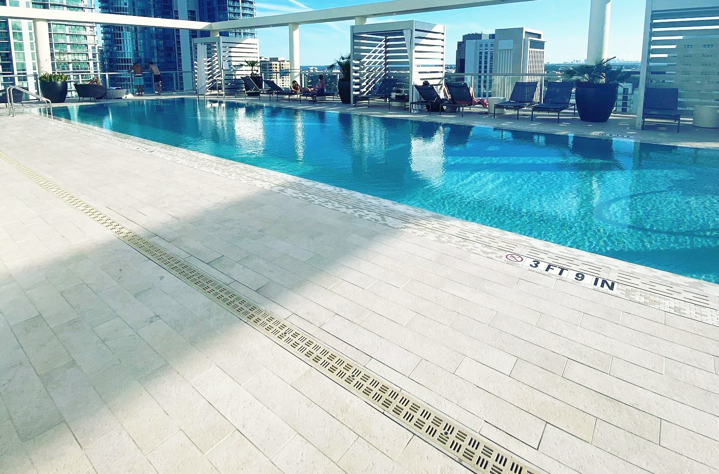 stone grating around the rooftop swimming pool at 4 West Las Olas