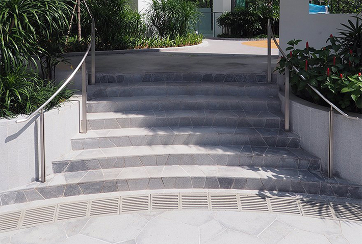 Jonite grates at the bottom of a staircase