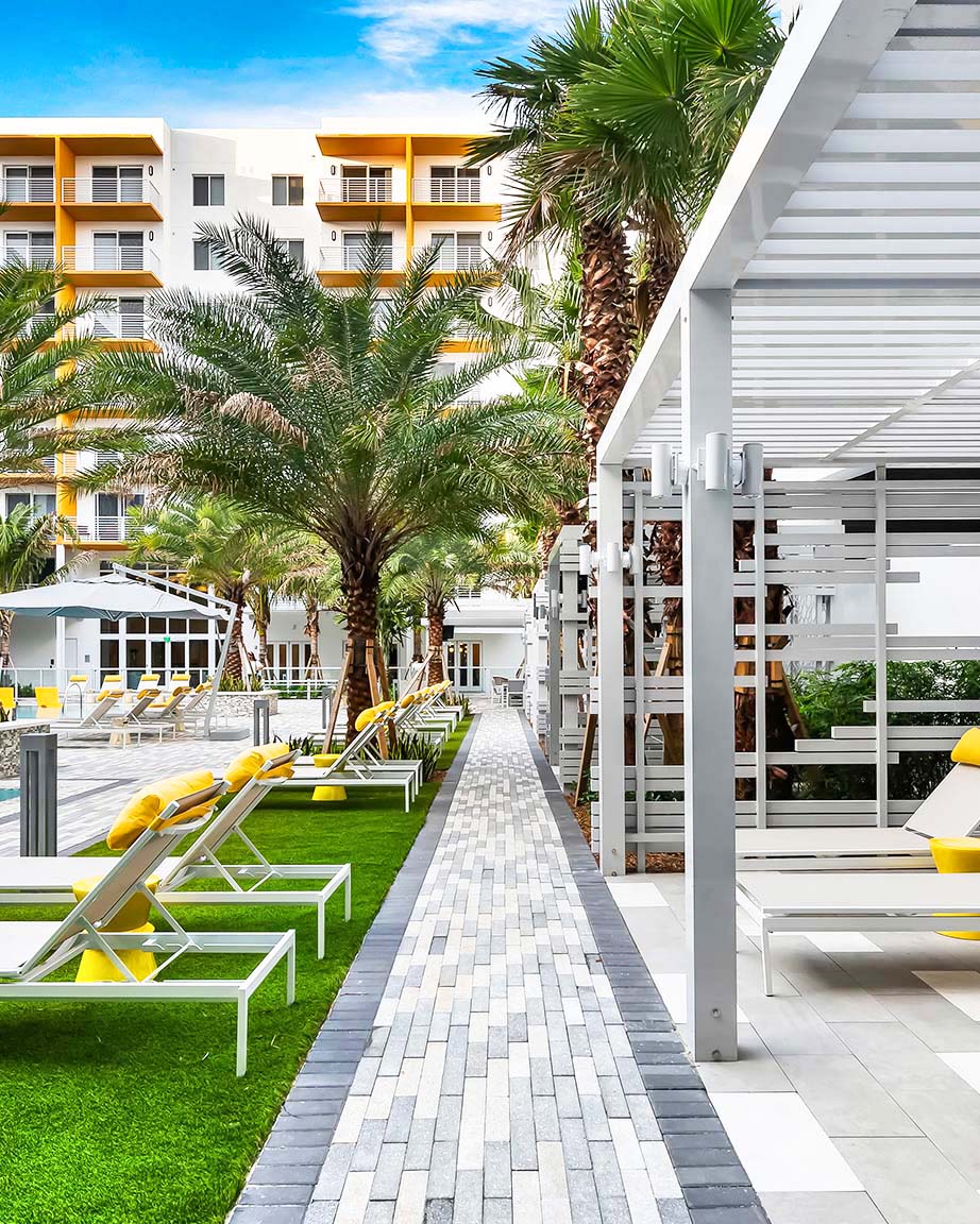 outdoor seating near the pool at Aura Boca