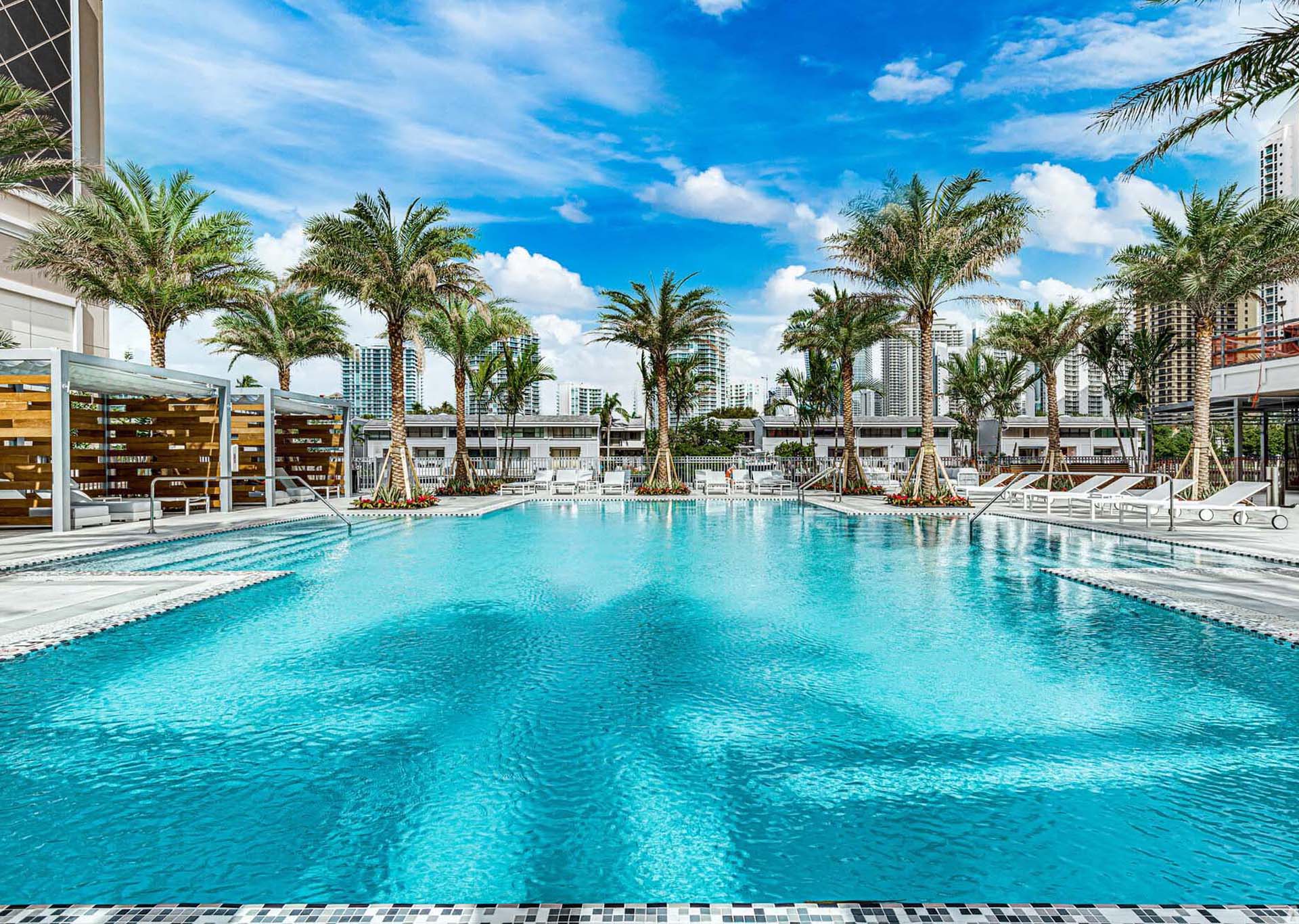 swimming pool and palm trees at Marina Del Mar