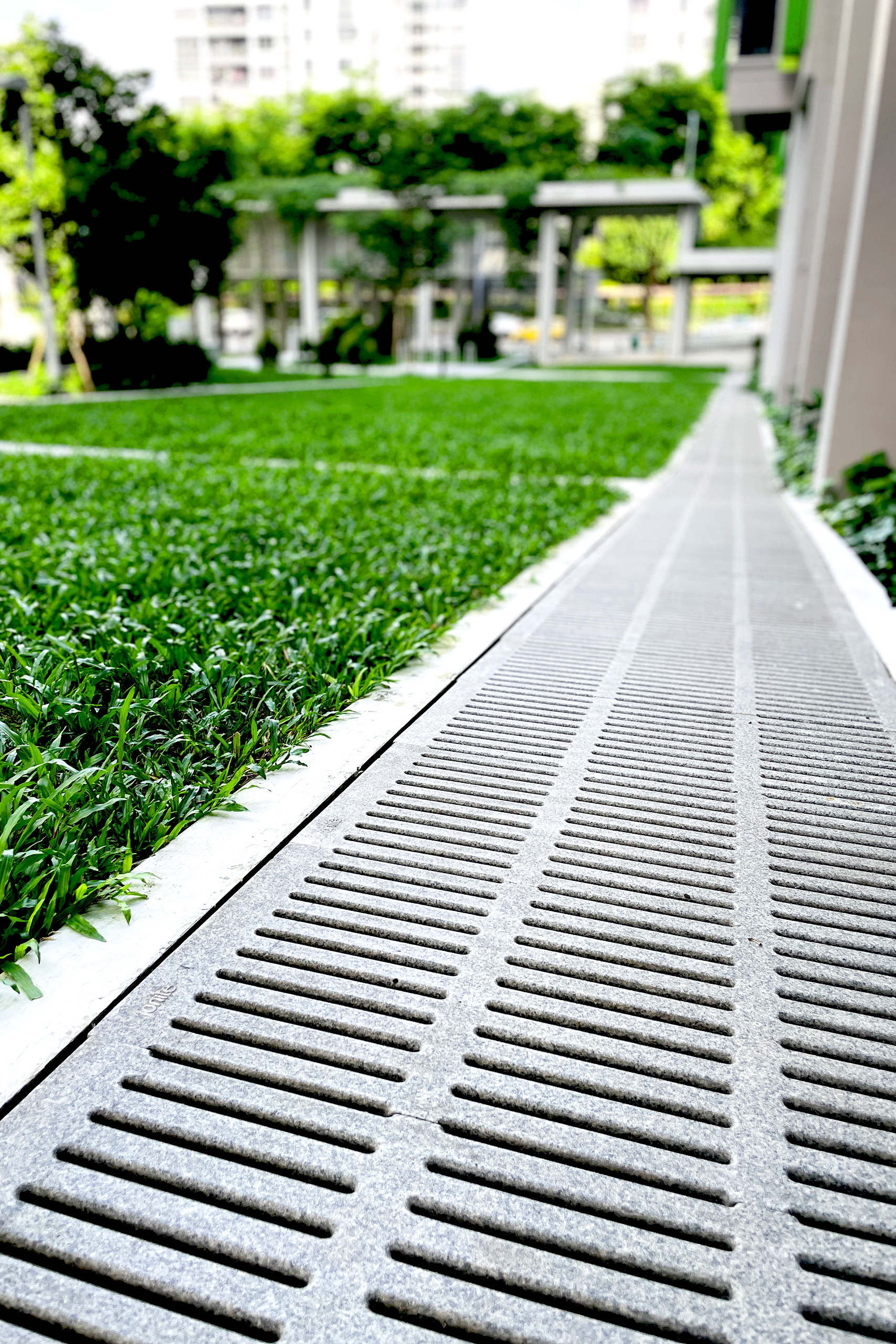 Jonite trench grates installed next to grass at the Bidadari Housing Development